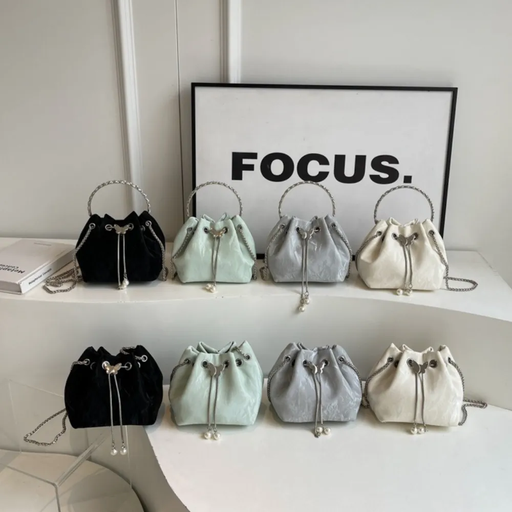 Women's leather crossbody bags in white black and green