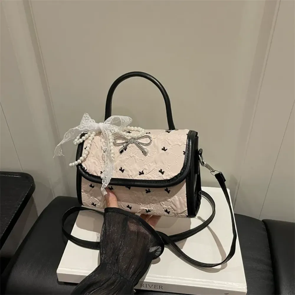 Black crossbody bag front view with scarf
