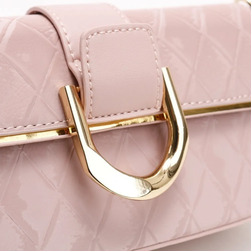 Pink crossbody bag buckle and hardware detail
