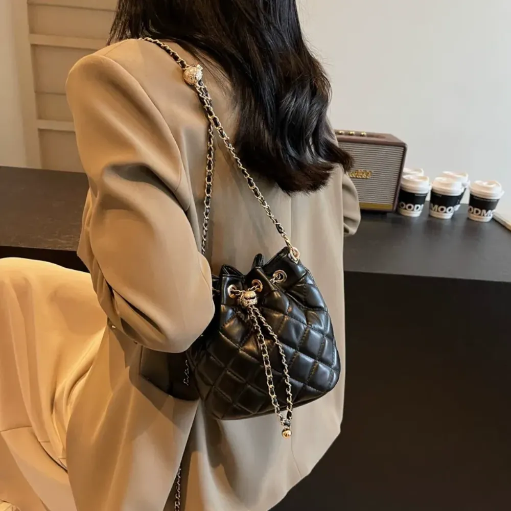 Woman carrying black women's crossbody bag