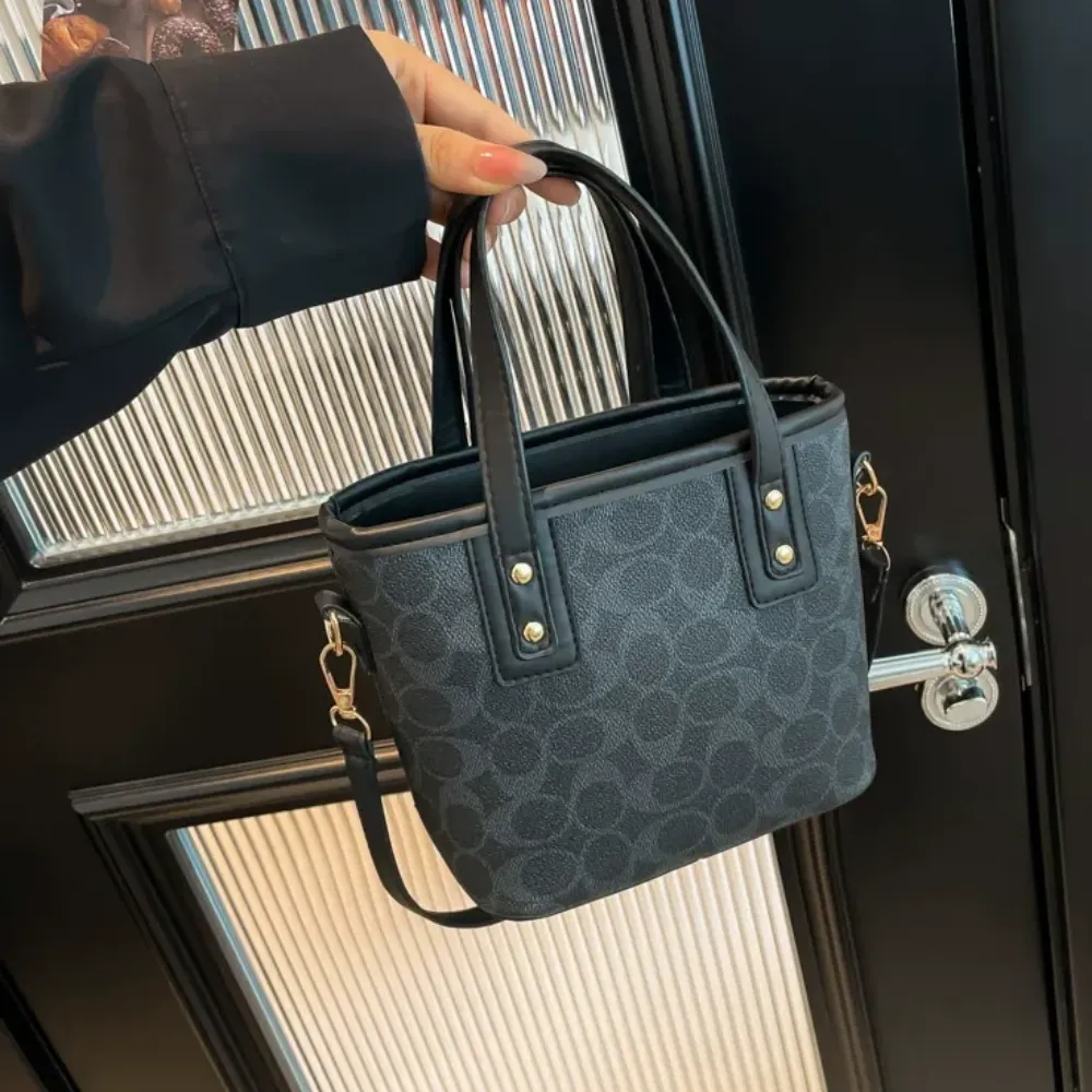 Black crossbody bag for women with brown handles