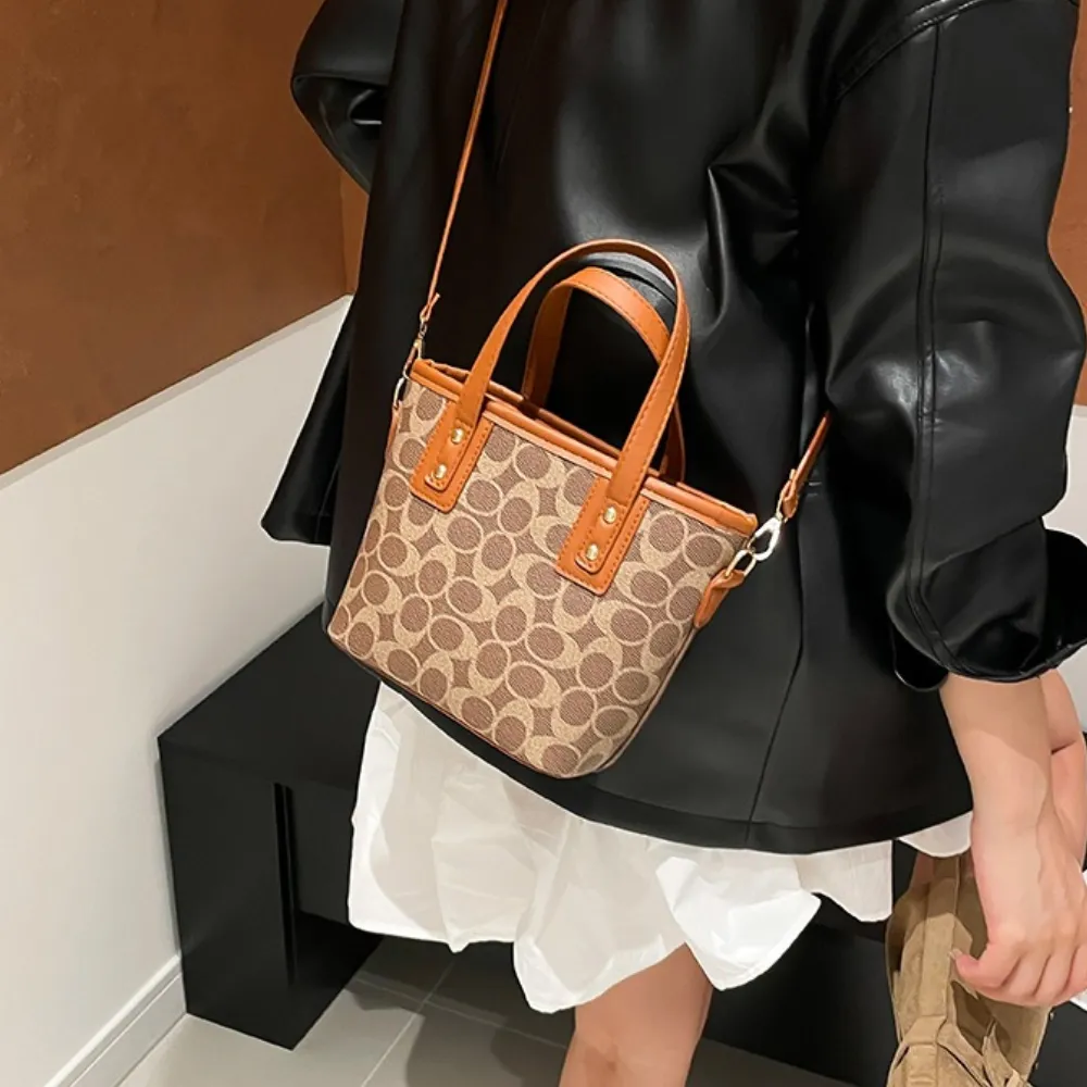 Brown patterned crossbody bag with top handles