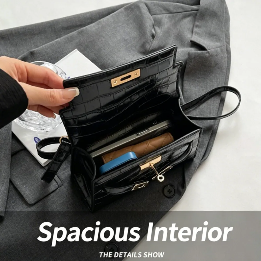 Black croc texture crossbody bag with spacious interior compartments