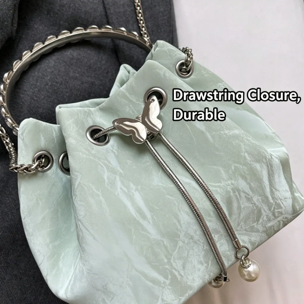 Mint green drawstring crossbody bag with durable closure