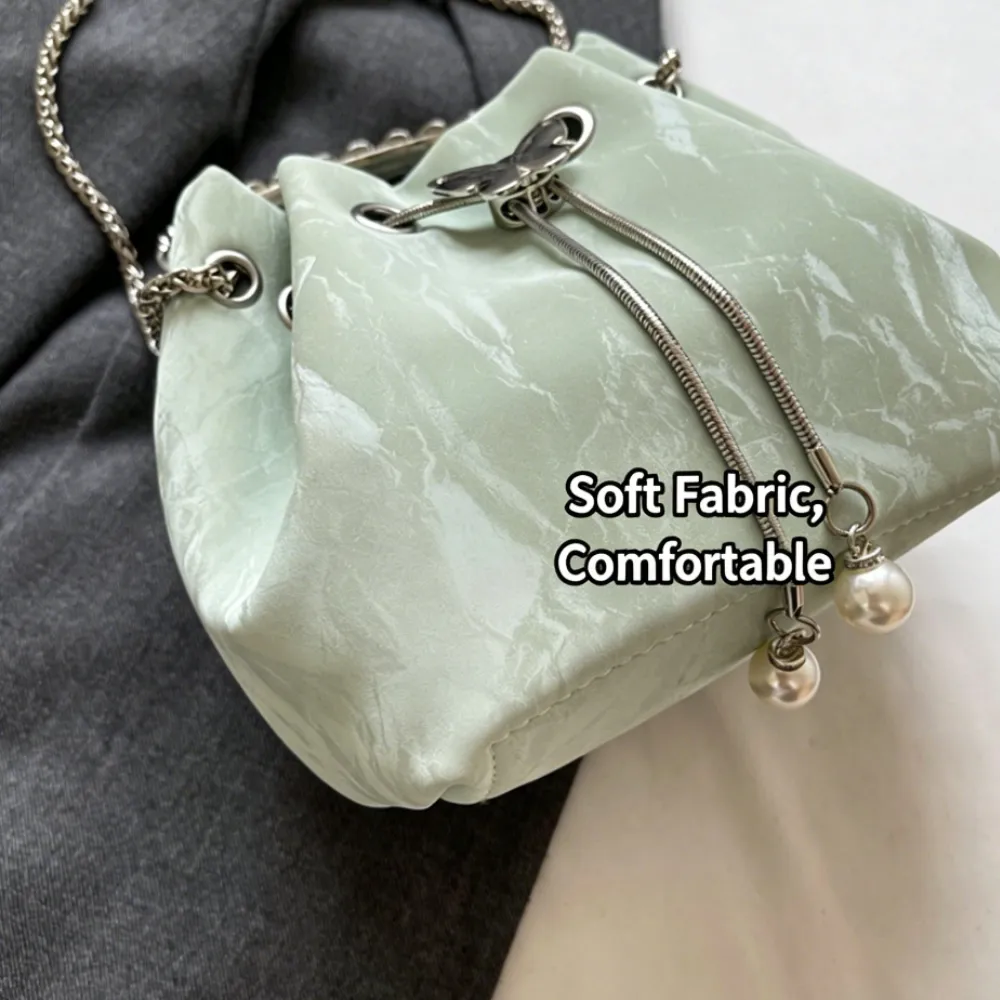 Mint green soft fabric crossbody bag with drawstring design