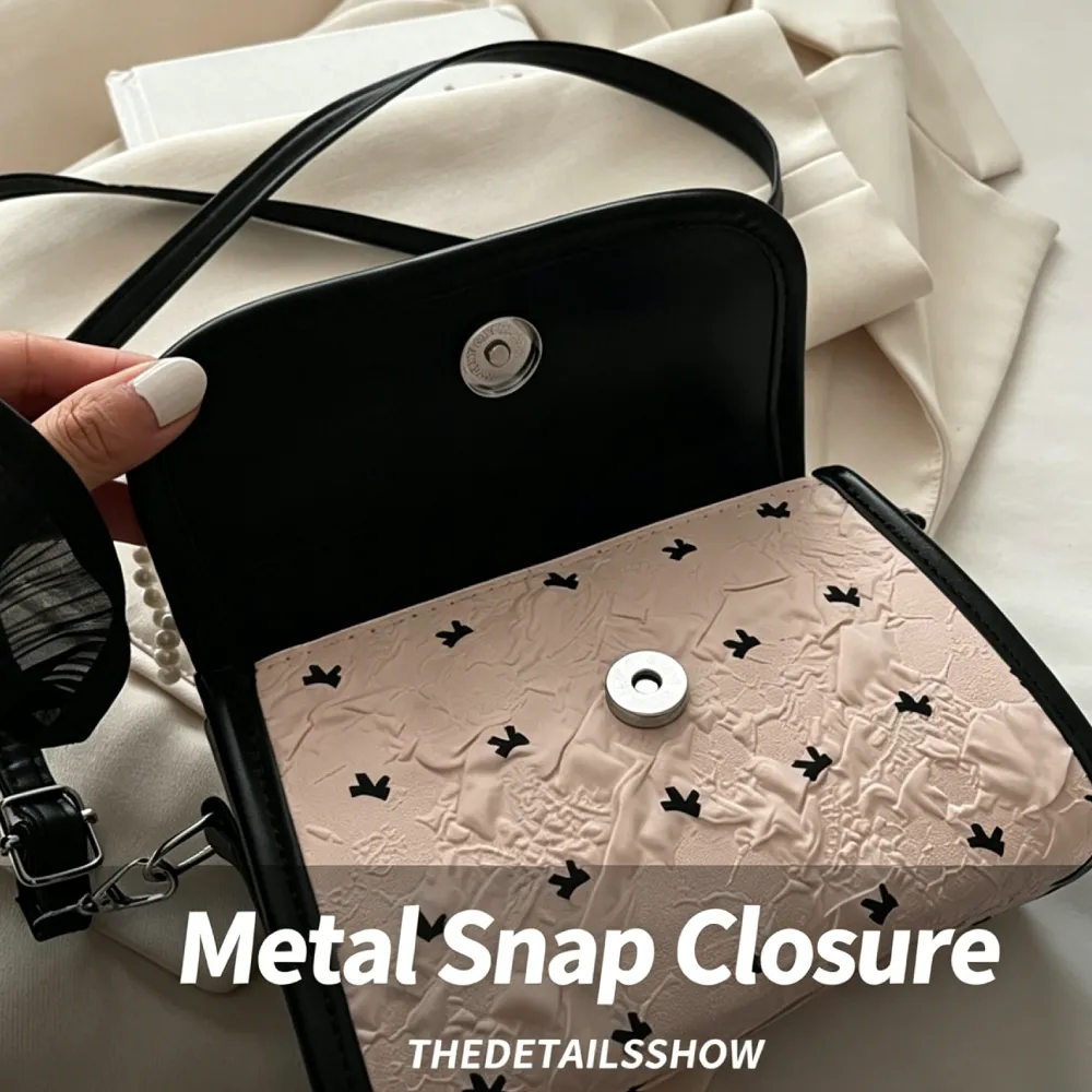 crossbody bag with metal snap closure