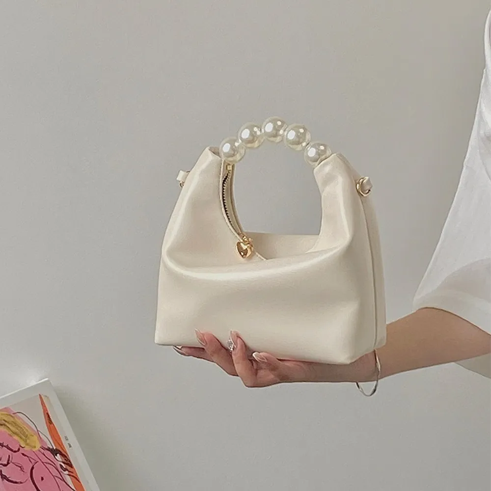 Crodar cream shoulder bag with pearl handle for women
