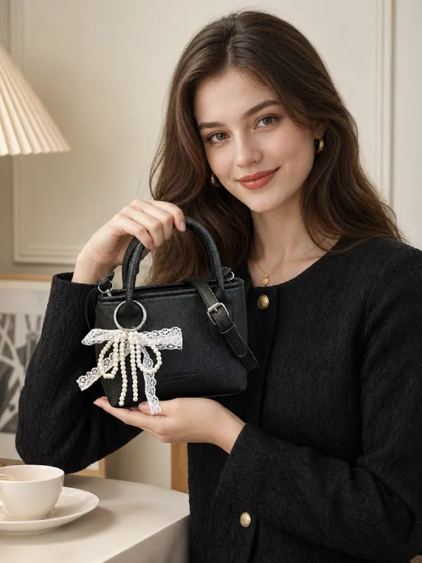 Black handbag with bow detail for women