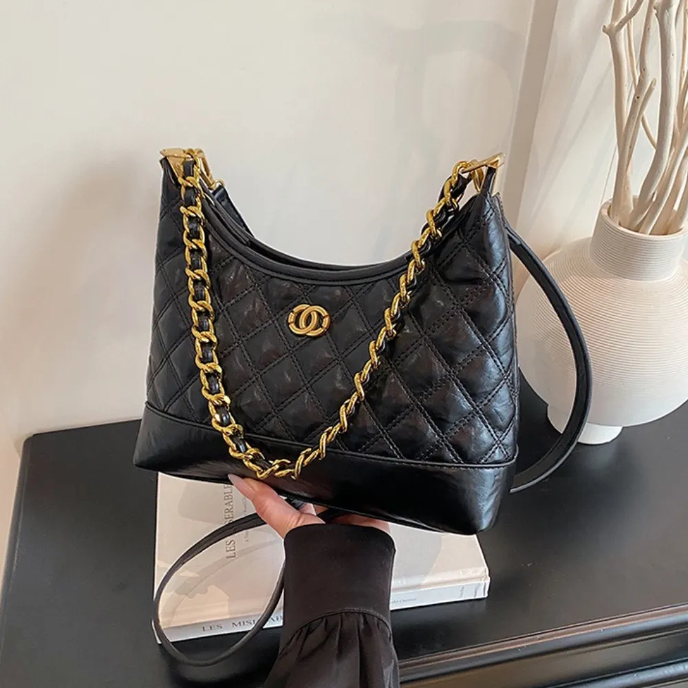 Black leather shoulder bag with gold chain strap for women