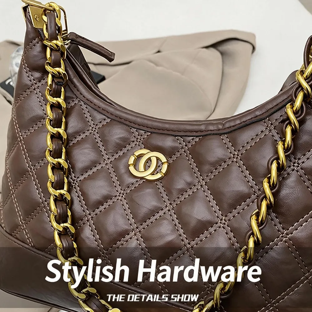 Gold chain hardware detail on women's leather shoulder bag
