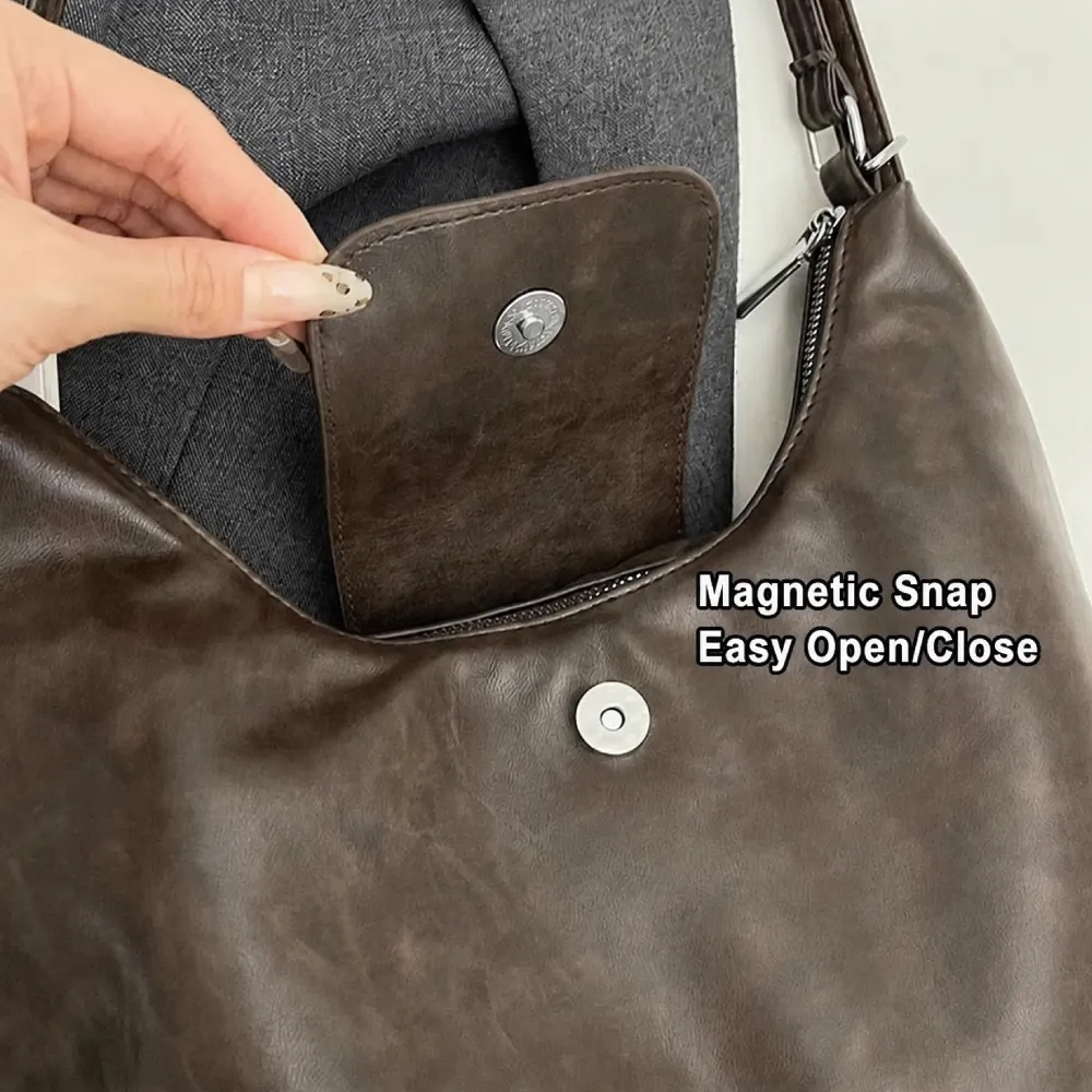 magnetic snap pocket detail inside leather shoulder bag