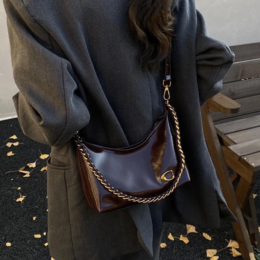 Woman wearing a brown leather shoulder bag
