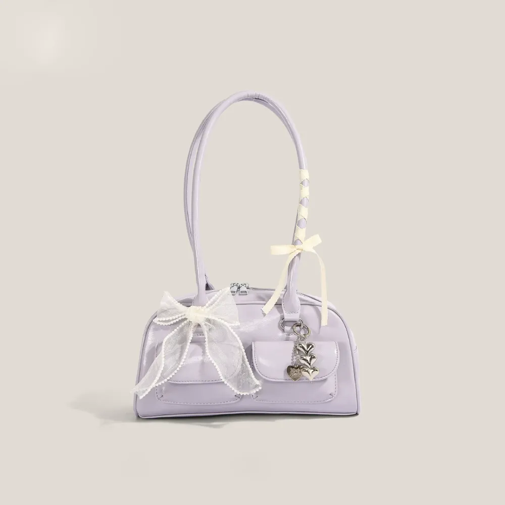 Purple bow shoulder bag with heart-shaped charm
