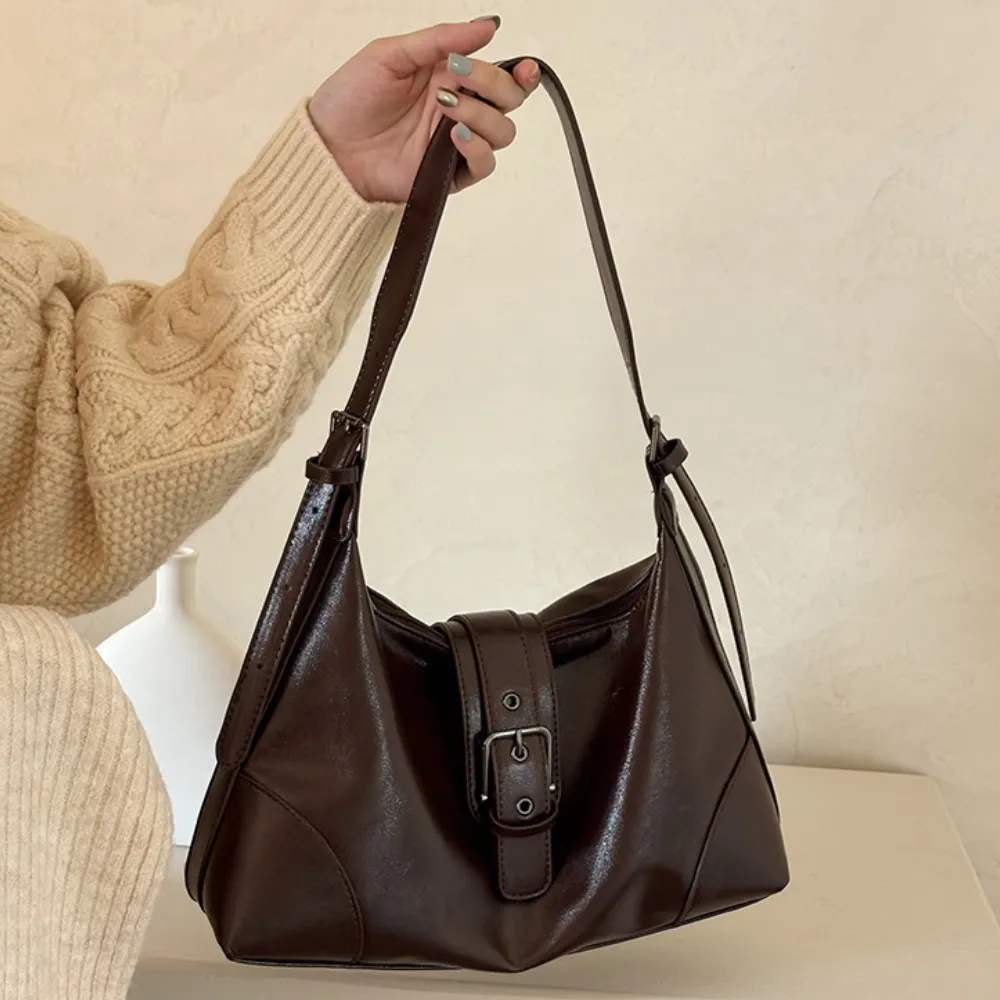 Woman carrying brown shoulder bag