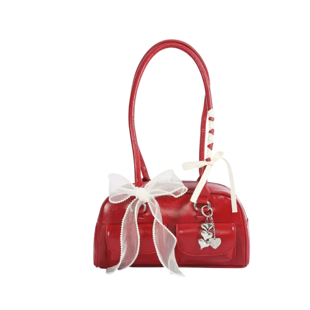 Red bow shoulder bag with heart-shaped charm