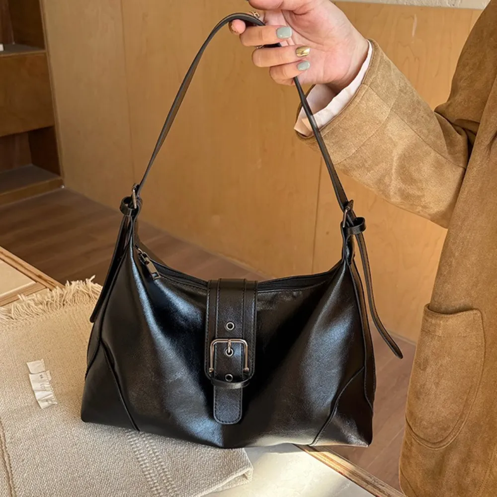 Adjustable strap detail on brown hobo shoulder bag