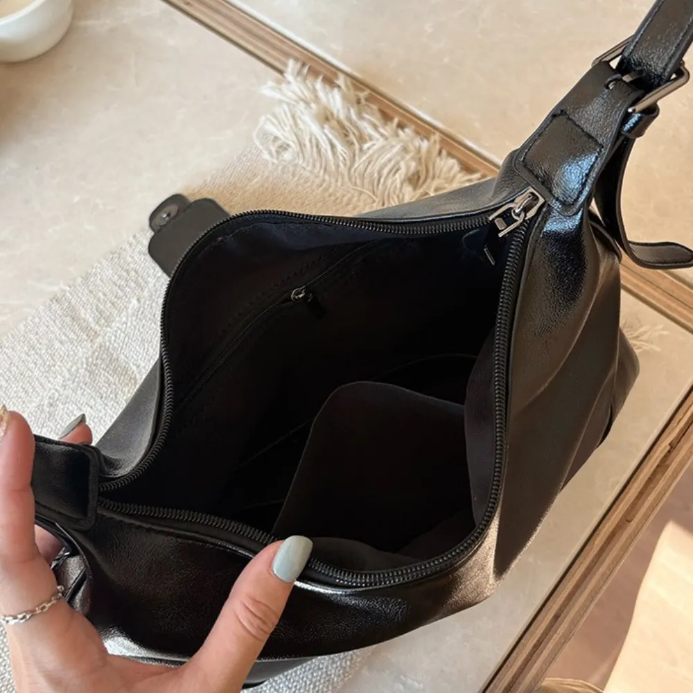 Spacious interior of brown women's shoulder bag