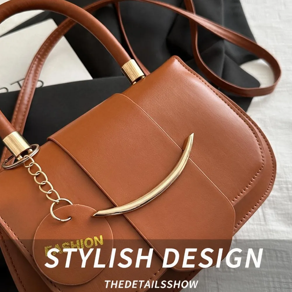 Brown women handbag with stylish curved front design and gold chain detail