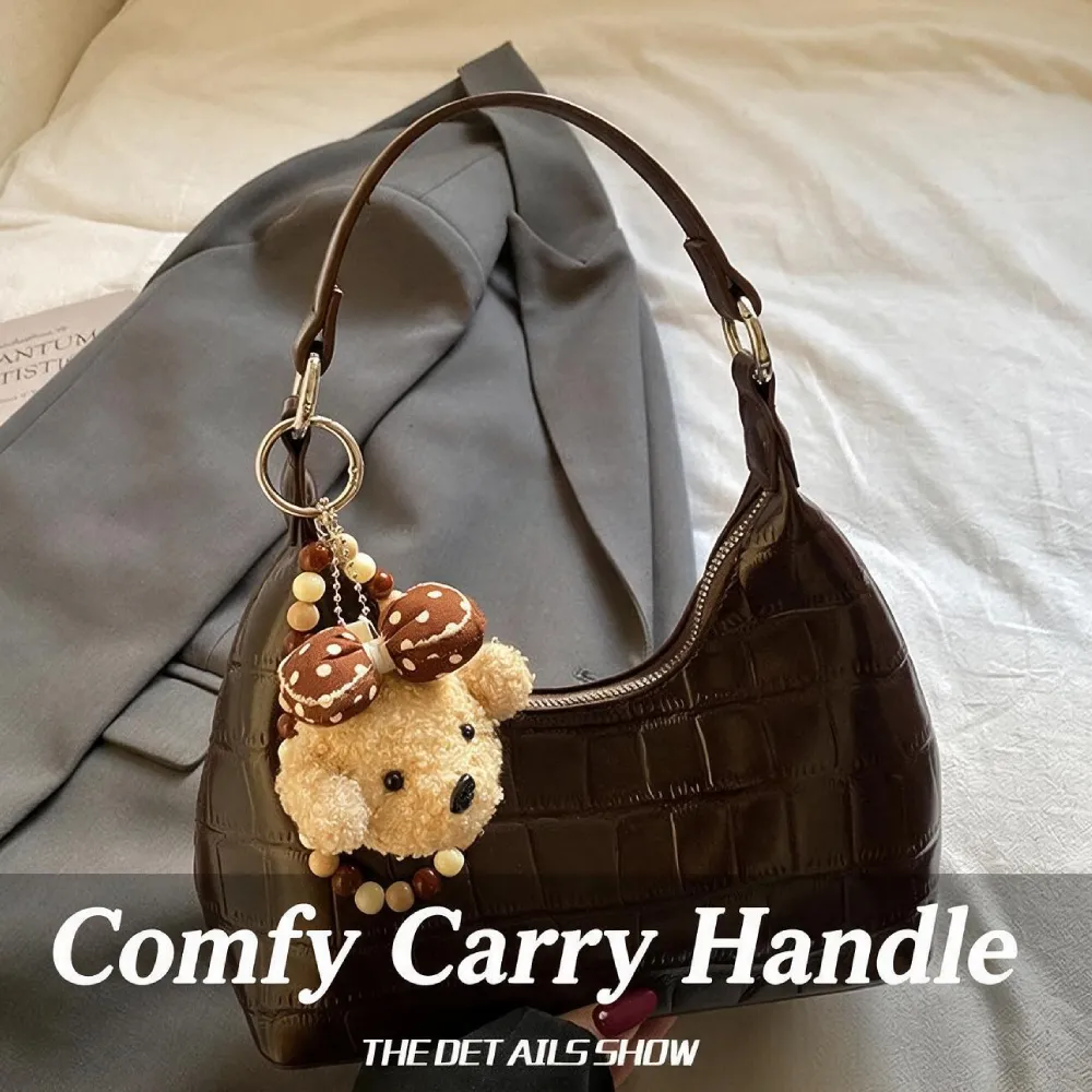 Brown women's handbag with comfortable carry handle