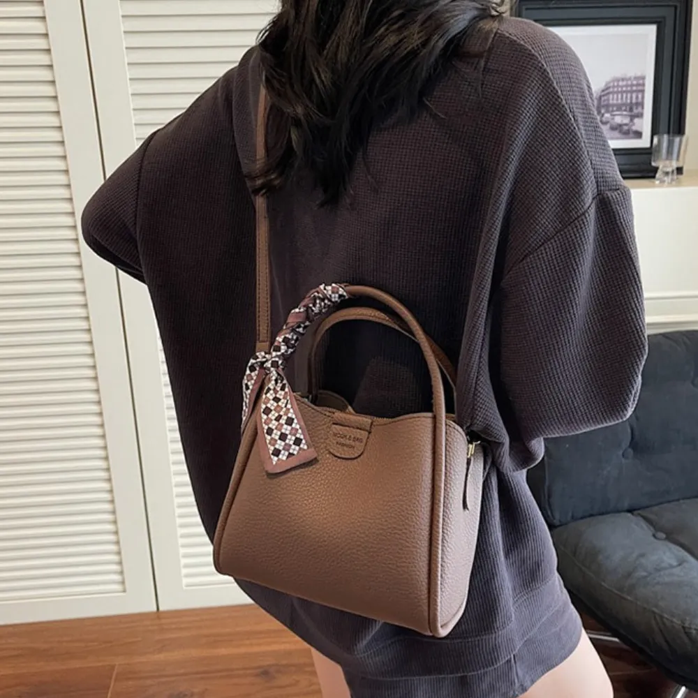 Brown crossbody bag styled with a casual everyday outfit