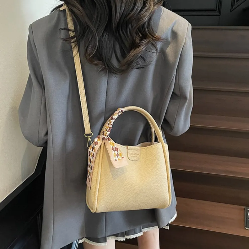white crossbody bag styled with a casual outfit
